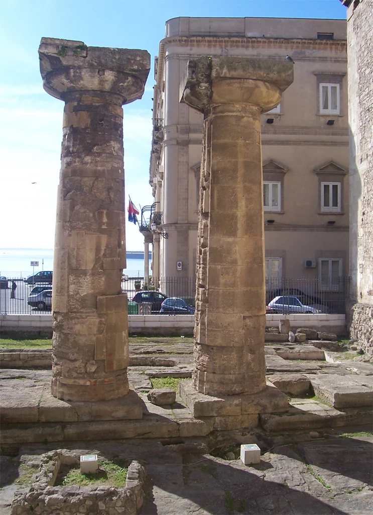 Two surviving Doric columns among modern buildings in Taranto